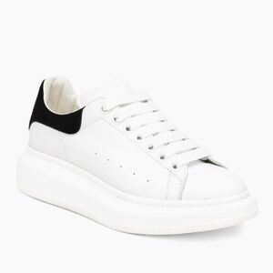 Alexander McQueen women’s oversized embossed logo sneakers